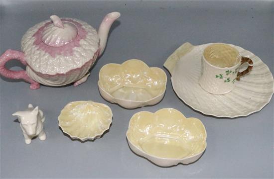 Belleek wares: white and pink glazed teapot, scallop dish, figure of a dog, & 4 other pieces